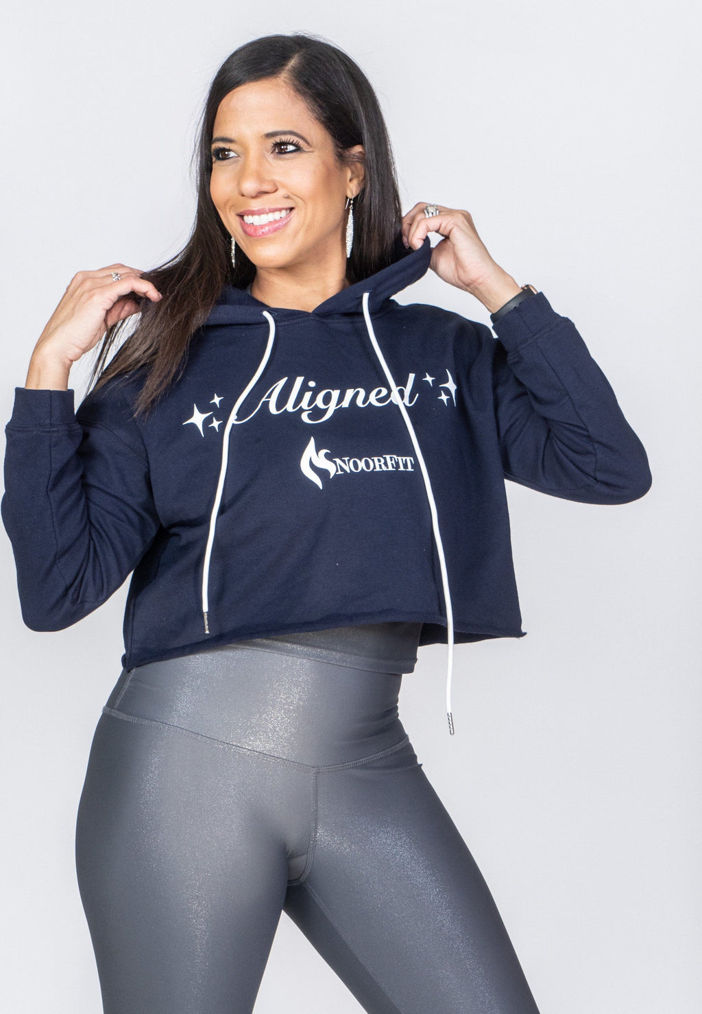 Image of a woman wearing the Aligned Crop Hoodie from NoorFit.