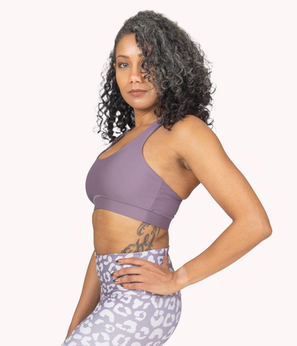 Image of a woman wearing the Mulberry Bra (strappy) from NoorFit.