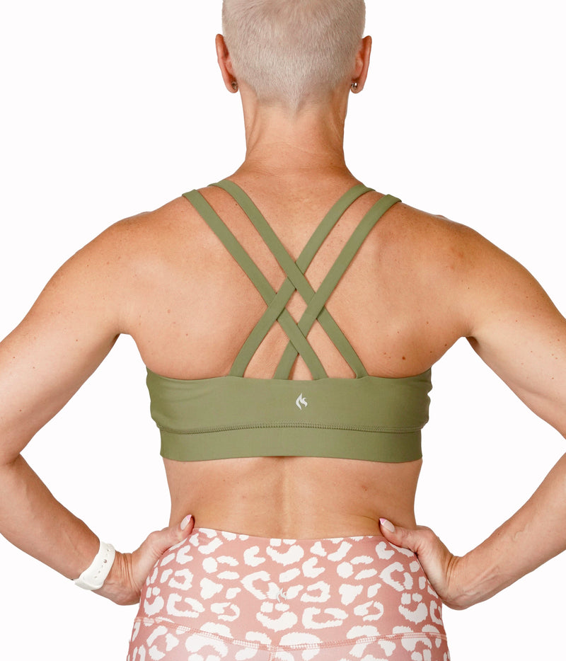 Image of a woman wearing the Rosemary Bra (strappy) from NoorFit. 