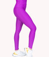 A woman wearing the Pink Saffron Legging from NoorFit.