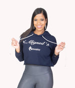 Image of a woman wearing the Aligned Crop Hoodie from NoorFit.