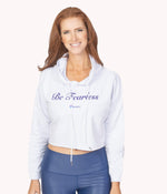 A model with red hair wearing the Be Fearless Crop Hoodie.