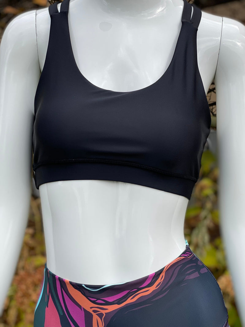 A mannequin with the Obsidian Bra with strappy design.